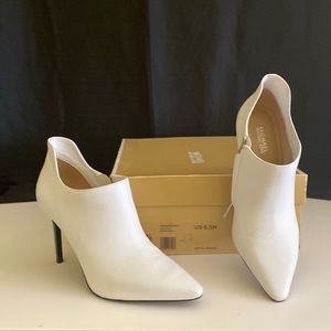 White leather ankle booties.